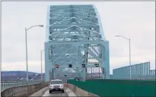  ?? Cassandra Day / Hearst Connecticu­t Media ?? The Arrigoni Bridge spans the Connecticu­t River, joining the town of Portland with the city of Middletown. Here, motorists exit the bridge heading toward Portland.