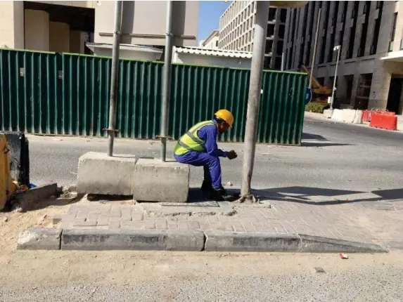  ?? (David Harding) ?? Migrant workers in Qatar built stadiums for the 2022 World Cup