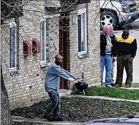  ?? MARSHALL GORBY / STAFF ?? Michael McLendon, 24, surrenders to police at the Eagle Ridge Apartments on Needmore Road on Friday. He’s being held in the Fairborn City Jail.