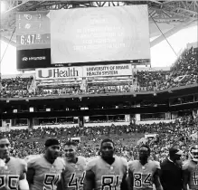  ?? BRYNN ANDERSON THE ASSOCIATED PRESS ?? Tennessee Titans players leave the field after a second lightning delay was called in Miami on Sunday. The Dolphins won the game, 27-20.