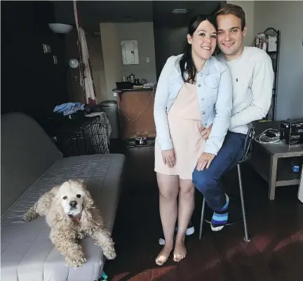  ?? TONY CALDWELL ?? Hayley Chazan and her boyfriend Richard Clark and their dog Hope relax in their apartment in Ottawa.