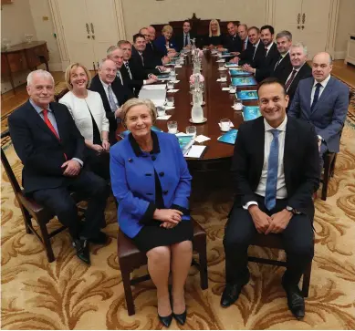  ?? Photo: Maxwells ?? New Taoiseach Leo Varadkar (front right) and Tánaiste Frances Fitzgerald (front left) pose for a picture along with the new front bench as they sit down in Áras An Uachtaráin for their first Cabinet meeting.