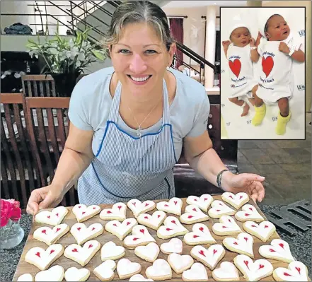  ?? Picture: SUPPLIED/MICHAEL PINYANA ?? FROM THE HEART: Salut Deli’s Robyn Spring baked heart-shaped biscuits for her Valentine’s Day picnic hampers. INSET: Kubobonke Njokweni and Mohadiah Mopp model the ‘Carried under mommy’s heart’ baby grows Life Beacon Bay is giving to babies born on...