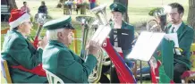  ?? PHOTO: RICHARD DAVISON ?? Seasonal cheer . . . Balclutha Brass members (from left) Jillian Breach, Bill Cross, Cassie Winslade (12) and Dale Anderson play carols for Clinton residents on the town triangle on Thursday night.