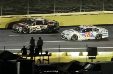  ?? MIKE MCCARN — THE ASSOCIATED PRESS ?? Austin Dillon passes Jimmie Johnson (48) en route to winning the Coca-Cola 600 at Charlotte Motor Speedway in Concord, N.C. on Monday.