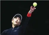  ??  ?? GETTY IMAGES Garbine Muguruza hits a serve shot against Jelena Ostapenko at the 2017 WTA Finals in Singapore Indoor Stadium on October 22, 2017.