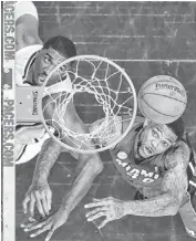  ?? AP ?? Indiana Pacers center Roy Hibbert (left) and Miami Heat forward Udonis Haslem battle for a rebound during Game 6 in Indianapol­is on Saturday. Indiana’s victory takes the series to Game 7.