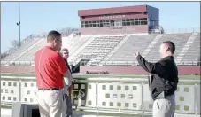  ?? LYNN KUTTER ENTERPRISE-LEADER ?? Brad Blew, Farmington athletic director, talks with Kevin Downing, athletic director for Siloam Springs School District. Downing gave school officials a tour of the football facility.