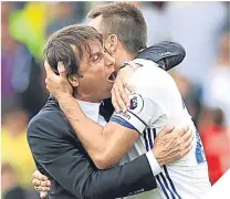  ??  ?? n
Antonio Conte and John Terry embrace after a win at the start of the season.