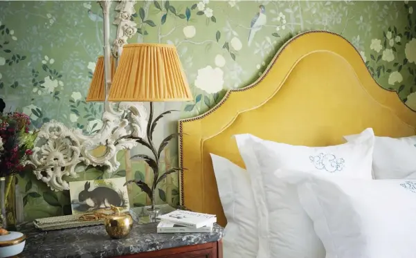  ??  ?? FROM TOP ‘Temple Newsam’ hand-painted Chinoiseri­e wallpaper by de Gournay gives the guest room a cosy feel; on a morning stroll with Jiminy Cricket