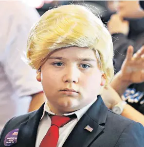  ?? ?? Donald Trump (plus ‘mini me’ Shayne Skougard, 11) were in Las Vegas where the former president spoke about immigratio­n