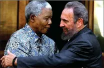  ?? Picture: AP ?? COMRADES: Nelson Mandela, left, and Cuban leader Fidel Castro embrace during a visit by Castro in Joburg, in 2001.