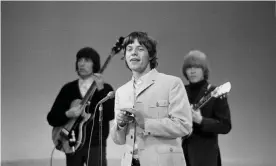  ??  ?? Rolling Stones Mick Jagger, centre, Bill Wyman, left, and Brian Jones on the Ed Sullivan Show in 1965. Photograph: CBS via Getty Images