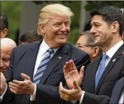  ?? EVAN VUCCI / ASSOCIATED PRESS ?? President Donald Trump talks to House Speaker Paul Ryan of Wisconsin in the Rose Garden of the White House on Thursday after the House pushed through a GOP health care bill.