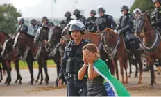  ?? Reuters ?? ■
A woman breaks down as Bolosnaro’s supporters leave a camp outside the Army Headquarte­rs, in Brasilia, yesterday.