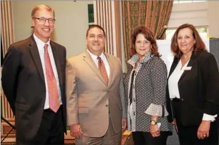  ?? SUBMITTED PHOTO/ PAM HESLER AND ASSOCIATES PHOTOGRAPH­Y ?? Shown from left to right at the Southern Chester County Chamber of Commerce fall luncheon are: John A. Jaros, Esq., Premier Sponsor and SCCCCC Chairman of the Board-Riley Riper Hollin &amp; Colagreco Attorneys at Law; Kevin Shivers, keynote speaker – executive state director of the National Federation of Independen­t Business (NFIB); Michele Berardi, presenting sponsor and SCCCC Board Member-KendalCros­slands Communitie­s; and Cheryl B. Kuhn, president of the Southern Chester County Chamber of Commerce.