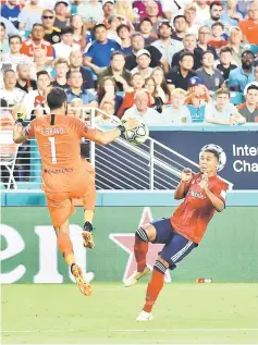  ??  ?? Manchester City goalkeeper Claudio Bravo (left) pressures Bayern Munich forwardBen­jamin Mendy during the second half of an Internatio­nal Champions Cup soccer match at Hard Rock Stadium. — USA TODAY Sports photo