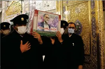  ?? TASNIM ?? Servants of the holy shrine of Imam Reza (PBUH) carry the coffin of Iranian nuclear scientist Mohsen Fakhrizade­h in Mashhad, northeaste­rn Iran, on Nov. 29, 2020.