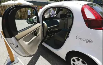  ?? Associated Press photo ?? This 2016 file photo shows a Google self-driving car on display at Google's I/O conference in Mountain View, Calif. Cars with no steering wheel, no pedals and nobody at all inside could be driving themselves on California roads by the end of 2017,...