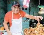  ??  ?? Flying fish — fried and with a dash of hot sauce — are for sale at Merida’s Lucas de Galvez market.