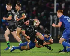  ??  ?? Wexford’s Paul Boyle (Connacht) is tackled by Max Deegan.