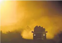  ??  ?? A Type VI brush truck from Gunnison County Fire Protection District comes off the fire line during the Pine Gulch fire. Helen H. Richardson, The Denver Post