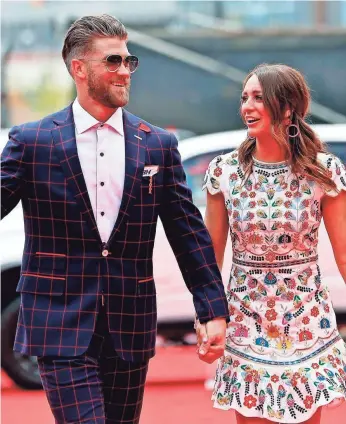  ?? GEOFF BURKE/USA TODAY SPORTS ?? Harper and his wife, Kayla, arriving before the 2018 All-Star Game in Washington, D.C., have talked with teams that have shown an interest in the free agent.