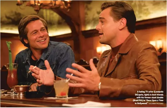  ?? COLUMBIA PICTURES ?? A fading TV actor (Leonardo DiCaprio, right) is best friends
with his former stunt double (Brad Pitt) in “Once Upon a Time
in Hollywood.”