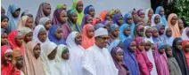  ?? - Nigeria Presidency/Handout via Reuters ?? ELATED: Nigeria’s President Muhammadu Buhari meets with some of the newly released Dapchi schoolgirl­s in Abuja, Nigeria March 23, 2018.
