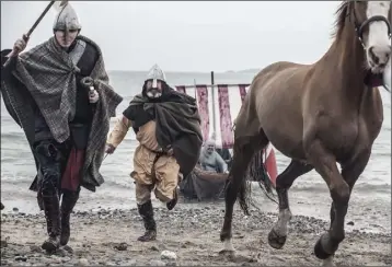  ??  ?? Norman soldiers storm Bannow Beach in a reenactmen­t of the invasion of 1169