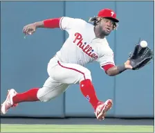  ?? JEFF ROBERSON — THE ASSOCIATED PRESS ?? Phillies center fielder Odubel Herrera reaches out and catches a fly ball by the Cardinals’ Paul DeJong during the sixth inning Thursday in St. Louis.