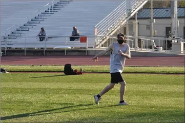  ?? PHOTOS BY JUSTIN COUCHOT — ENTERPRISE-RECORD ?? Gavin Lawrence, a member of the Chico State men’s ultimate frisbee team, throws a frisbee to a teammate at the team’s first practice of the season Thursday at University Stadium.