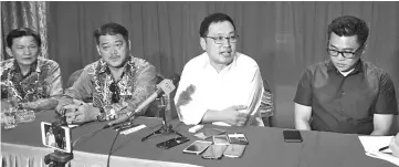 ??  ?? Chong (second right) speaking to reporters after meeting with coffee shop owners yesterday.Also seen here areTan (right) and Hii (second left).