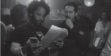  ?? ANNAPURNA ?? Director Boots Riley (left) and actor Steven Yeun work on the set of "Sorry to Bother You." PETER PRATO/