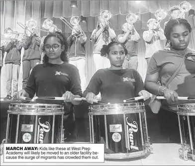  ?? ?? MARCH AWAY: Kids like these at West Prep Academy will likely be moved to an older facility because the surge of migrants has crowded them out.