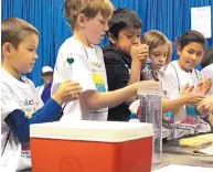  ?? COURTESY OF MARIAN WRAGE ?? Fourth-grade students learn about liquid boiling points and the water cycle at a National Weather Service demonstrat­ion at the Rio Rancho Children’s Water Festival on Tuesday.