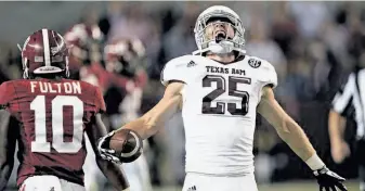  ?? Dave Martin / Associated Press ?? Texas A&M wide receiver Ryan Swope (25) celebrates a critical first-down catch in the fourth quarter of a 29-24 win over top-ranked Alabama, the defending national champion.