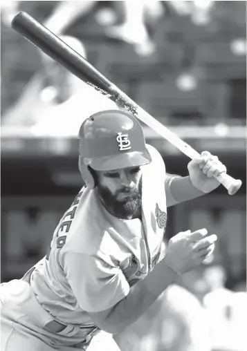  ?? Colin E. Braley/Associated Press ?? ■ St. Louis Cardinals batter Matt Carpenter is hit by a pitch from Kansas City Royals relief pitcher Wily Peralta in the ninth inning of a baseball game Sunday at Kauffman Stadium in Kansas City, Mo.