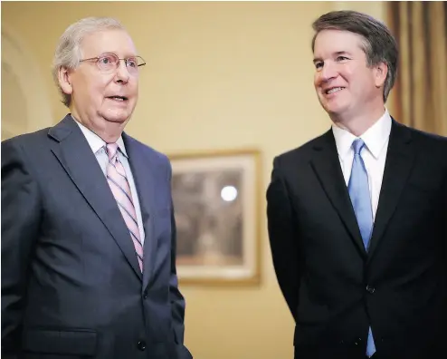  ?? CHIP SOMODEVILL­A / GETTY IMAGES ?? Senate Majority Leader Mitch McConnell, left, speaks with U.S. Supreme Court nominee Judge Brett Kavanaugh in Washington on Tuesday.