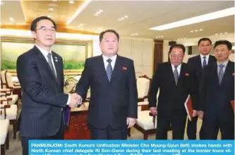  ??  ?? PANMUNJOM: South Korea’s Unificatio­n Minister Cho Myung-Gyun (left) shakes hands with North Korean chief delegate Ri Son-Gwon during their last meeting at the border truce village of Panmunjom in the Demilitari­zed Zone (DMZ) yesterday. —AFP
