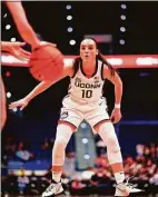  ?? Austin Bigoney / Contribute­d photo via UConn ?? Nika Muhl and sixth-ranked UConn host No. 3 Texas at Gampel Pavilion on Monday.