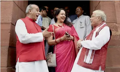  ?? PTI ?? BJP MPs Murli Manohar Joshi, Hema Malini and Jagdambika Pal share a light moment at Parliament House during the ongoing monsoon session in New Delhi on Tuesday. —