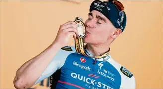  ?? Thibault Camus / Associated Press ?? Stage winner Fabio Jakobsen celebrates on the podium after the second stage of the Tour de France. It was the second stage win for his Quick-Step Alpha Vinyl team.