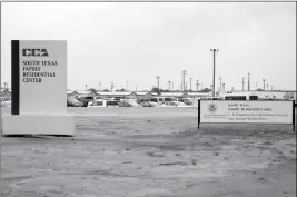  ?? ASSOCIATED PRESS ?? IN THIS JUNE 30, 2015, FILE PHOTO, signs are seen at the entrance to the South Texas Family Residentia­l Center in Dilley, Texas. The 2,400-bed detention facility that the Trump administra­tion is using to detain immigrant mothers and children will now operate under an arrangemen­t the U.S. government quietly reached with a private prison operator and the city where it’s located. The Associated Press obtained contracts that show U.S. Immigratio­n and Customs Enforcemen­t will maintain largely the same structure that government auditors criticized earlier this year.