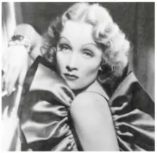  ??  ?? Travis Banton designed Dietrich’s costume for The Devil Is Woman (above) and for her Hollywood debut in Morocco (below). Her ever-present cigarette influenced a generation who adopted it as a gesture of effortless style