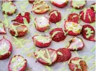  ?? Associated Press ?? ■ Roasted Radishes with Green Goddess Dressing tops plain roasted radishes with a quick green goddess dressing made from Greek yogurt, lemon juice, dill and parsley.