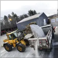  ?? KRISTOPHER RADDER ?? Crews from Brattlebor­o, Vt., Public Works Department loads up plow trucks with road salt onwednesda­y, Dec. 16, 2020, before the start of the winter stormthat is to hit the area Wednesday night and will go into Thursday.