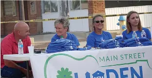  ??  ?? n Main Street board members Robert Luzio, from left, Terressa Wall, Luci Trahan and Anderson are supporting Music on Main Street and selling the popular Linden civic T-shirts. Allie