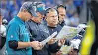  ?? AP PHOTO ?? In this Oct. 9, 2016, file photo, from left, Philadelph­ia Eagles offensive coordinato­r, Frank Reich, head coach Doug Pederson, offensive line coach Jeff Stoutland and tight ends coach Justin Peelle talk during an NFL game against the Detroit Lions in...