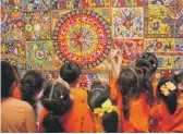  ?? PROVIDED ?? Children admire the Huichol mural “The New Awakening” at the National Museum of Mexican Art.